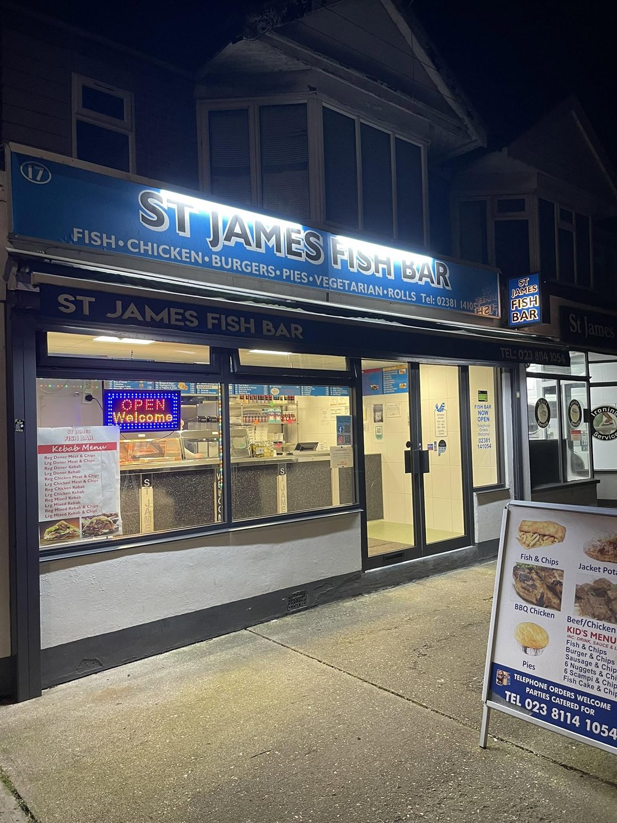 St James Fish Bar shopfront at 17 St James Road, Shirley, lit up in the evening
